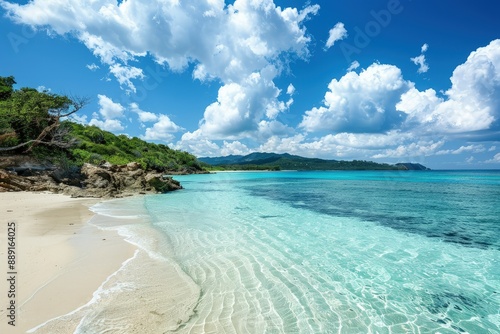 a sandy beach with clear blue water under a cloudy sky