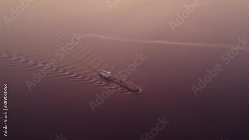 Aerial view of tranquil lake with morning fog and vessel, Jistrum, Friesland, Netherlands. photo