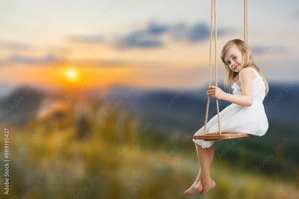 Child girl plays on wooden swing outdoor Child girl plays on wooden swing outdoor