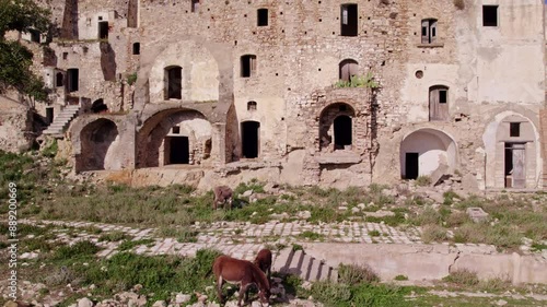 Aerial view of abandoned town with ruins on hill, Craco, Basilicata, Italy. photo