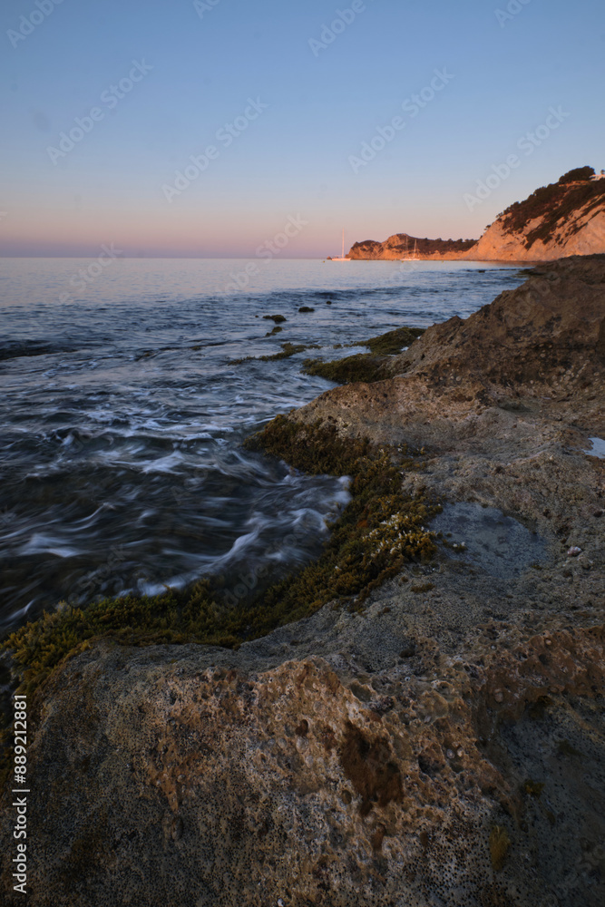 seascape rocky beach at sunset seascape rocky beach at sunset