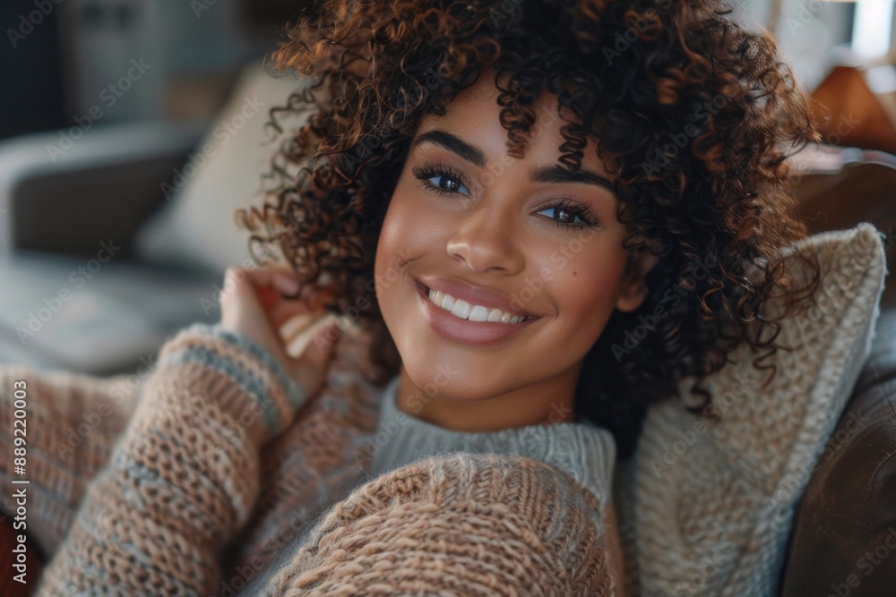 Smiling woman with curly hair relaxing at home. Cozy autumn style. Portrait photograph of a cheerful person. Ideal for lifestyle blogs and social media content. Generative AI Smiling woman with curly hair relaxing at home. Cozy autumn style. Portrait photograph of a cheerful person. Ideal for lifestyle blogs and social media content. Generative AI