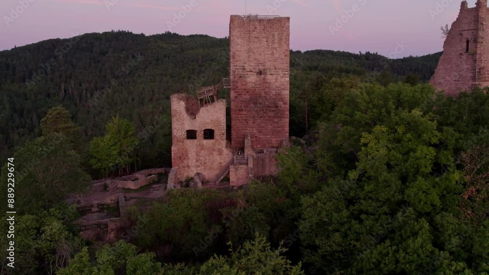 Aerial view of medieval castle ruins amidst forest and mountains, Husseren-les-Chateaux, Haut-Rhin, France. Aerial view of medieval castle ruins amidst forest and mountains, Husseren-les-Chateaux, Haut-Rhin, France.