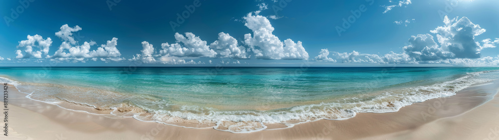 Panoramic View of a Sandy Beach With Clear Blue Water and White Clouds on a Sunny Day Panoramic View of a Sandy Beach With Clear Blue Water and White Clouds on a Sunny Day