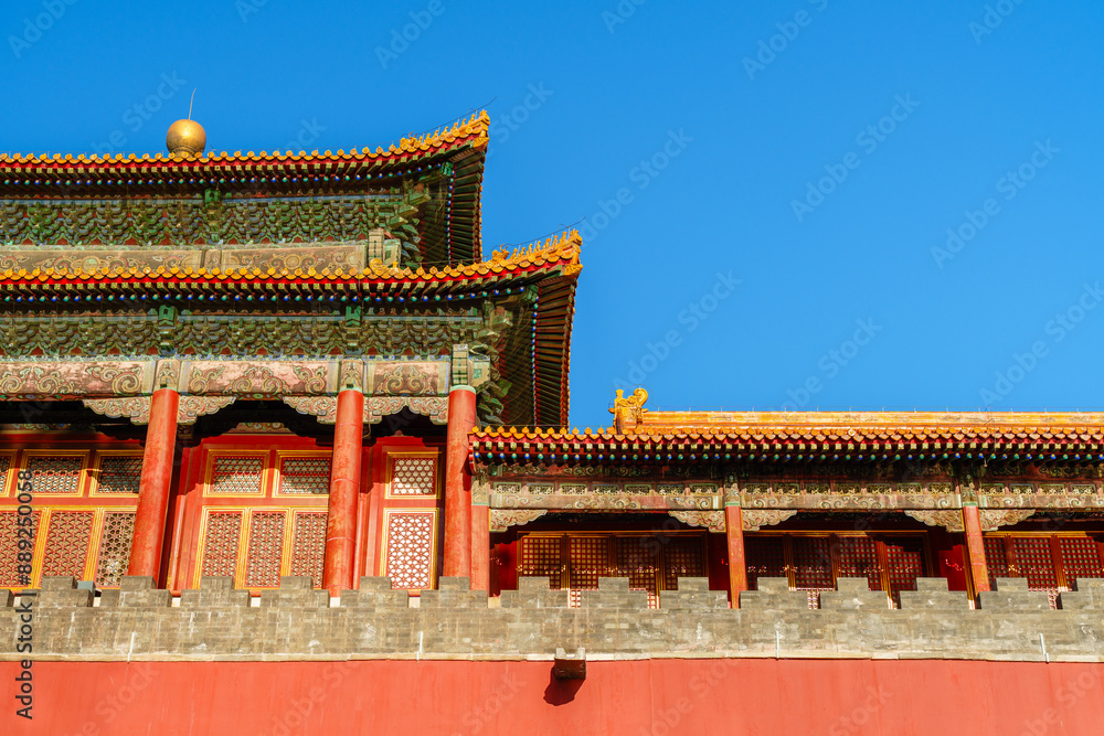 Naklejka premium Decoration Details of Yanchi Tower in Forbidden City under sun and blue sky