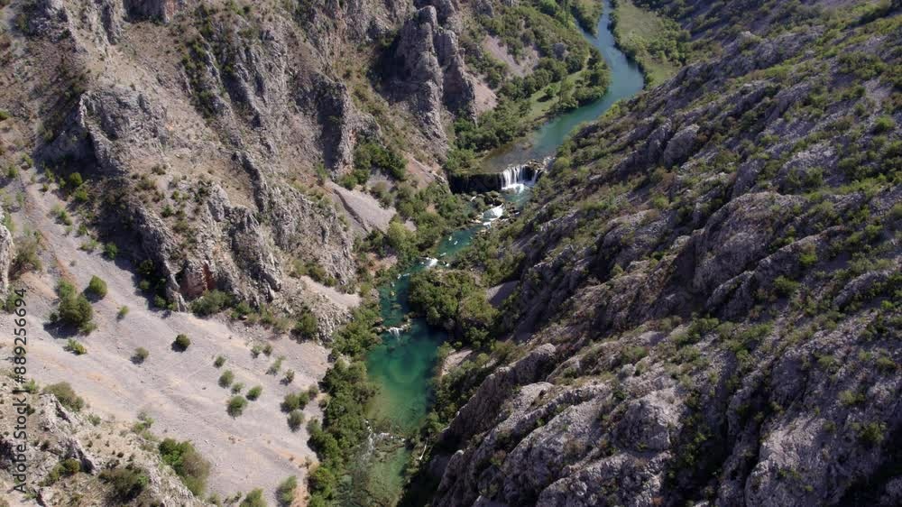 Aerial view of clear river winding through majestic canyon and mountain, Zrmanja, Croatia. Aerial view of clear river winding through majestic canyon and mountain, Zrmanja, Croatia.