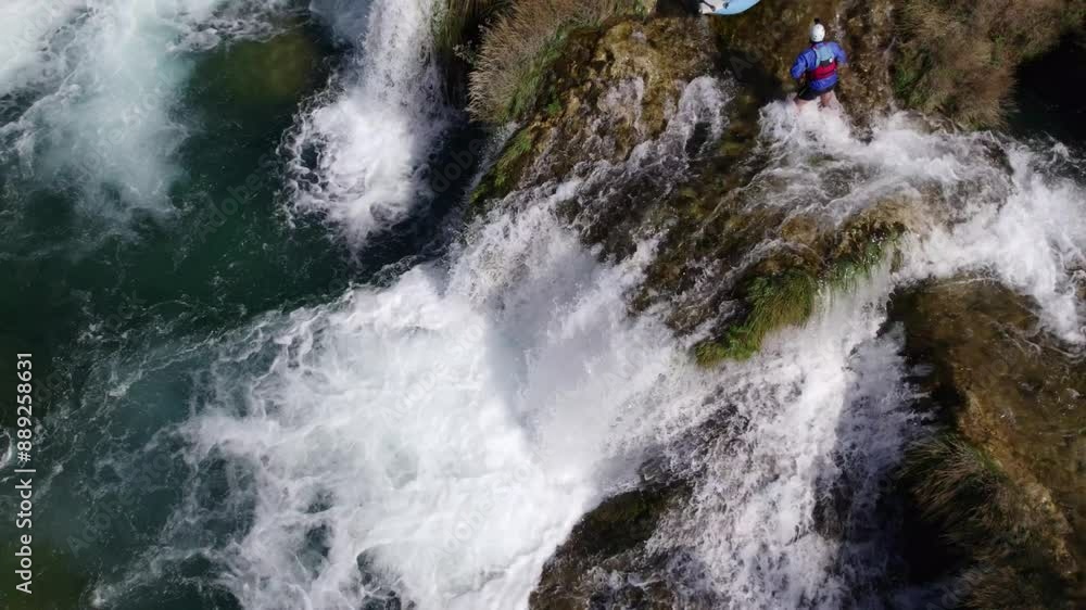 Aerial view of breathtaking waterfall and river with mountain backdrop, Zrmanja, Croatia. Aerial view of breathtaking waterfall and river with mountain backdrop, Zrmanja, Croatia.