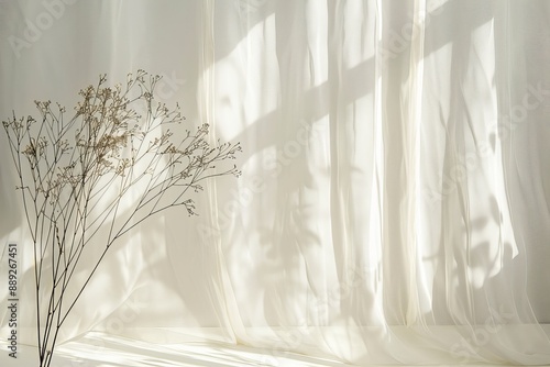Beige linen fabric backdrop with natural light shadows.