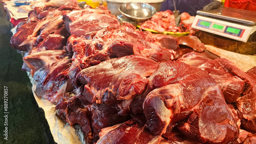 Close-up of freshly butchered beef cuts displayed at a local market stall