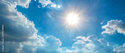 Background banner of a blue sky with sunshine sunbeams and sunrays with clouds in the distance © Bundi