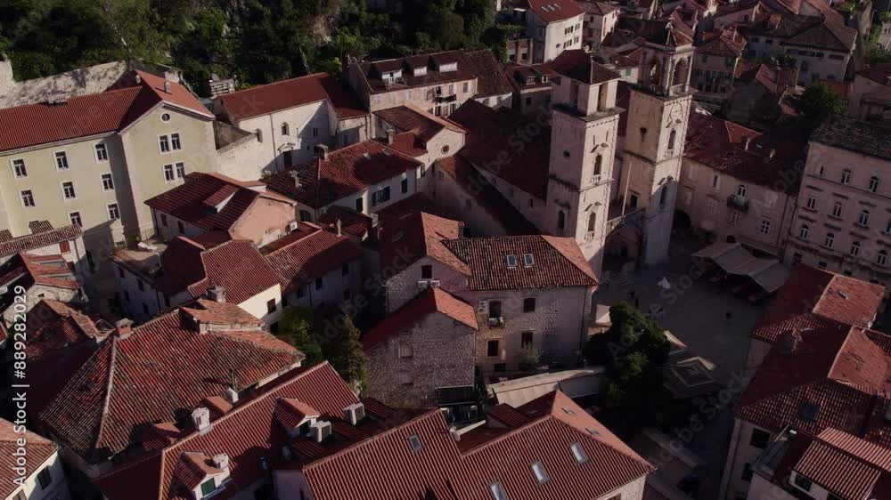 Aerial view of medieval town with church, harbor, and mountain, Kotor Bay, Montenegro.