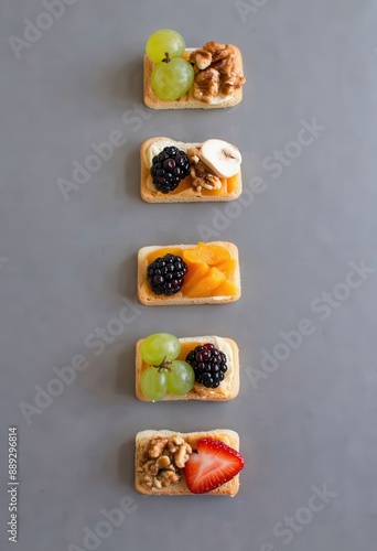 Four-tiered snack platter with assorted fruits and nuts