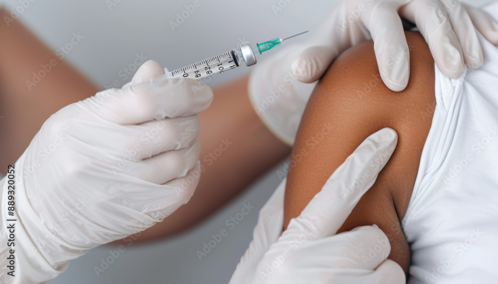 A nurse is giving a shot to a patient A nurse is giving a shot to a patient