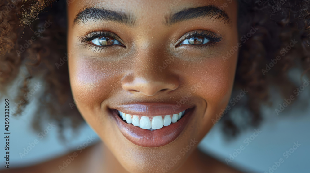 a close-up of a beautiful young woman smiling. a close-up of a beautiful young woman smiling.