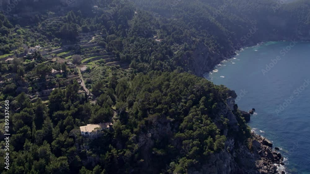 Aerial view of rocky coast and sea with forest and cliffs, Torre del Verger, Mallorca, Spain. Aerial view of rocky coast and sea with forest and cliffs, Torre del Verger, Mallorca, Spain.
