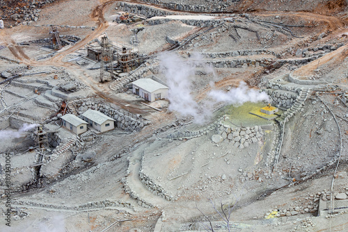 High angle view of mine warehouses covered with sulfur besides vapor on the volcano hill of Owakudani near Hakone, Kanagawa Prefecture, Japan
 photo