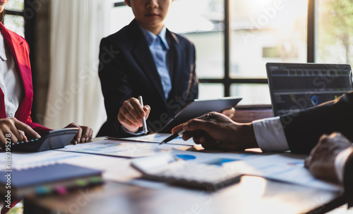 Business meeting, Company executives meeting discussing strategic analysis and business planning, group of people working with paperwork on a board room table at a business presentation or seminar.