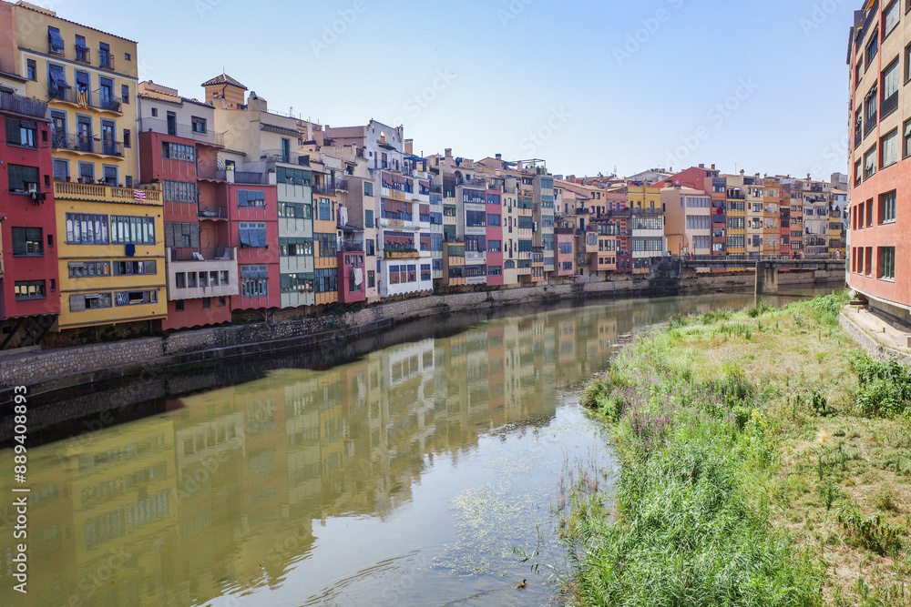 Girona, Spain - 18 July, 2024: Colorful buildings along the River Onyar, Girona, Catalonia Girona, Spain - 18 July, 2024: Colorful buildings along the River Onyar, Girona, Catalonia