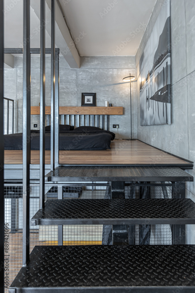 stylish minimalistic restrained modern interior of a two-storey apartment without people in the daytime in loft style in gray tones. stylish minimalistic restrained modern interior of a two-storey apartment without people in the daytime in loft style in gray tones.