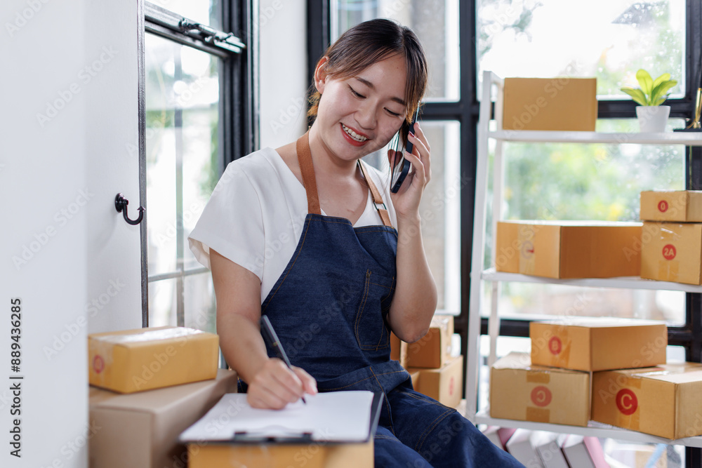 Starting small businesses SME owners asian female entrepreneurs call phone on receipt box and check online orders to prepare to pack the boxes, sell to customers, SME business ideas online.
Starting small businesses SME owners asian female entrepreneurs call phone on receipt box and check online orders to prepare to pack the boxes, sell to customers, SME business ideas online.