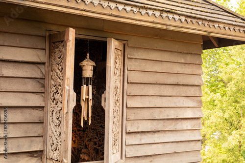 Wooden House with Ornate Ca...