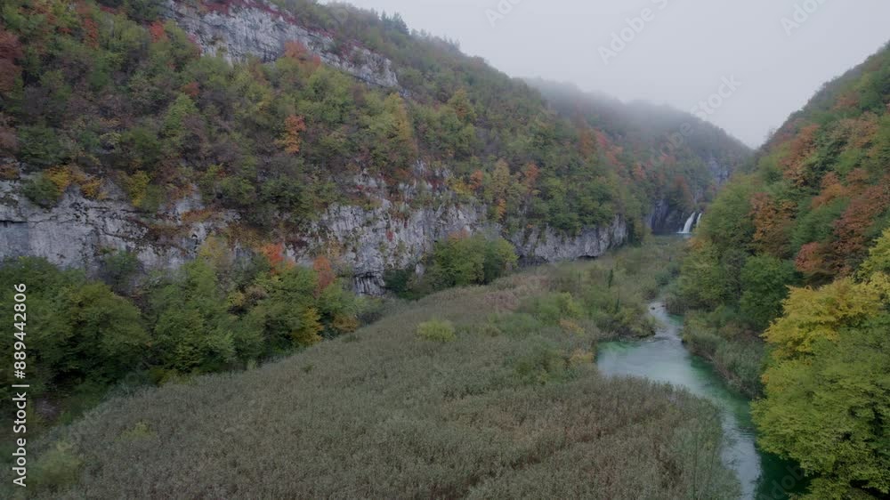 Aerial view of waterfall, river, cliffs, and valley in Plitvice National Park, Croatia. Aerial view of waterfall, river, cliffs, and valley in Plitvice National Park, Croatia.