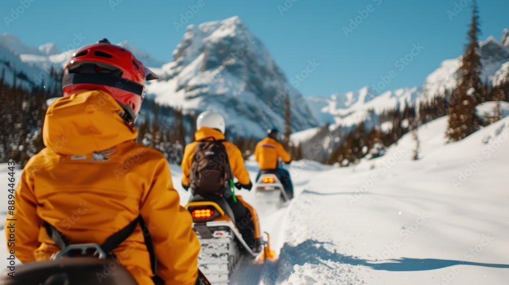 Individuals in bright yellow jackets ride snowmobiles over a snow-covered landscape, navigating through the snowy mountains, reveling in the thrill of winter sports and scenic beauty. Individuals in bright yellow jackets ride snowmobiles over a snow-covered landscape, navigating through the snowy mountains, reveling in the thrill of winter sports and scenic beauty.