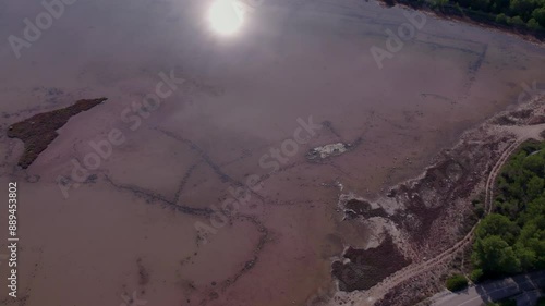 Aerial view of pink lake and town, Zablace, Sibenik, Croatia. photo