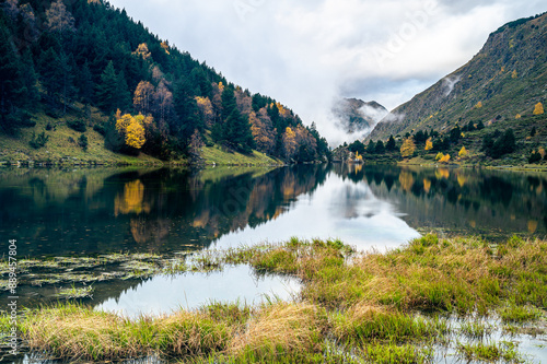 Beautiful lake in the mountains (Etang du Passet, France Pyrenees) photo