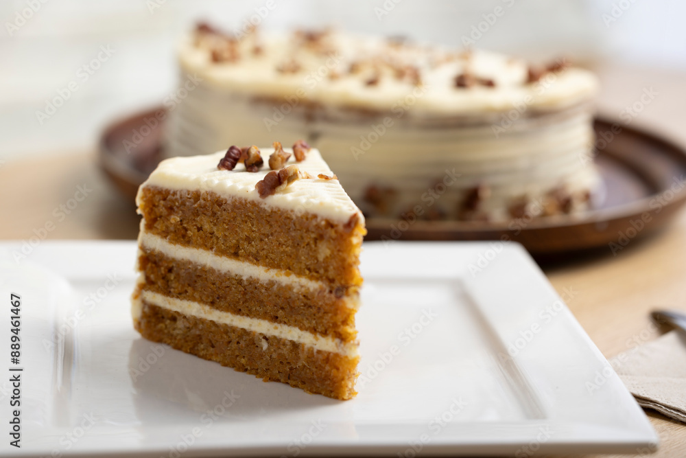 Delicious Slice of Carrot Cake with Cream Cheese Frosting. A mouth-watering close-up of a slice of carrot cake with rich cream cheese frosting. The cake is beautifully layered with moist, carrot Delicious Slice of Carrot Cake with Cream Cheese Frosting. A mouth-watering close-up of a slice of carrot cake with rich cream cheese frosting. The cake is beautifully layered with moist, carrot