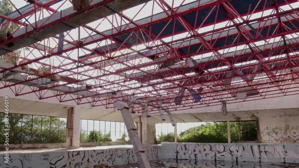 Aerial view of abandoned hotel with swimming pool and red metal structure, Kupari, Dubrovnik-Neretva, Croatia. Aerial view of abandoned hotel with swimming pool and red metal structure, Kupari, Dubrovnik-Neretva, Croatia.