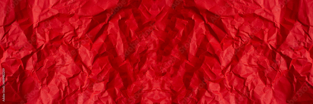 Wrinkled red paper texture,Rectangular crumpled sheet of red paper on a white isolated background Wrinkled red paper texture,Rectangular crumpled sheet of red paper on a white isolated background