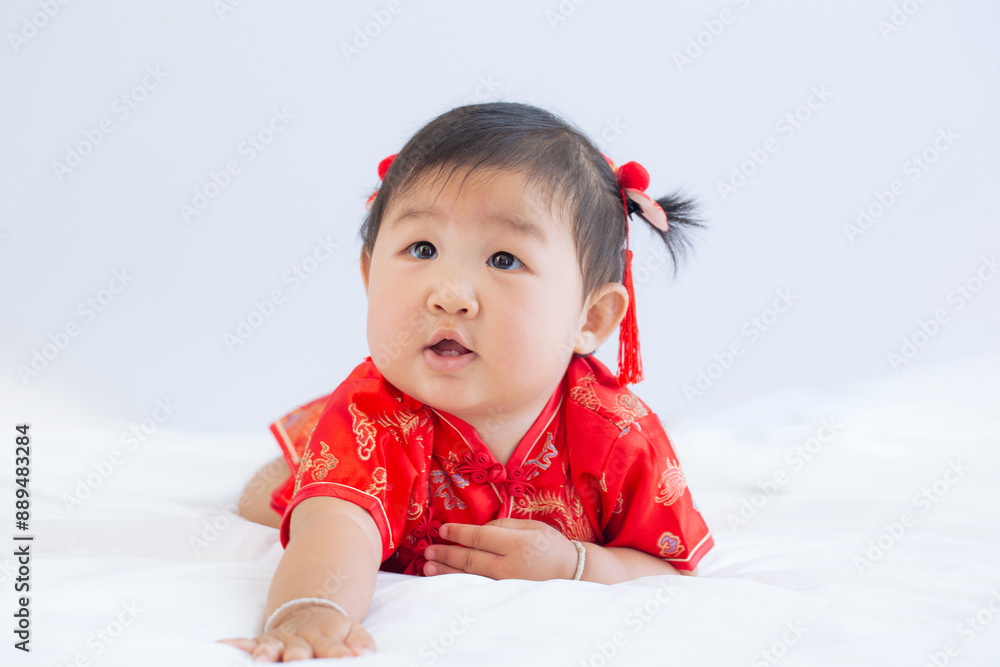 Girl in Chinese New Year costume,Happy Little asian girl in chinese traditional dress laughing and smiling. Girl in Chinese New Year costume,Happy Little asian girl in chinese traditional dress laughing and smiling.