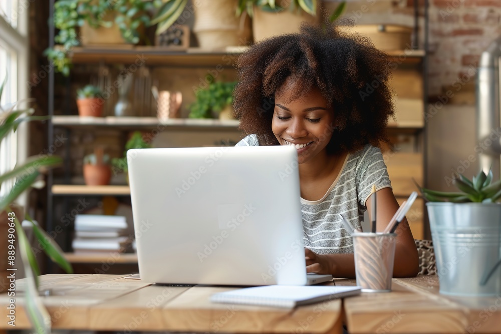 Smiling young African American woman sitting at desk wooden Smiling young African American woman sitting at desk wooden