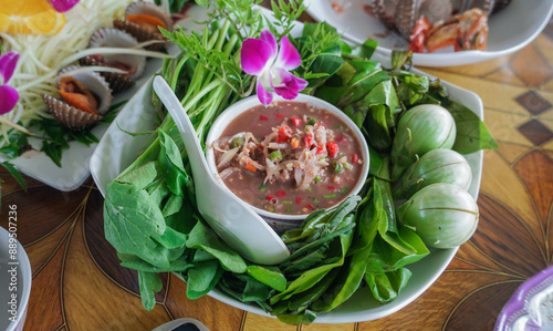 Namphrik kapi and blanched vegetable. Chili paste, spicy, sour, sweet, with the aroma of shrimp paste and smell of various spices is a menu that cane be found in almost every region of Thailand photo