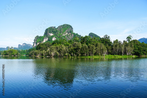 Beautiful clear sky at the swamp. Steam floats on the surface of the water with the reflection of the forest. Landscape with the image of lake Nong Thale, Krabi, Thailand. natural background.