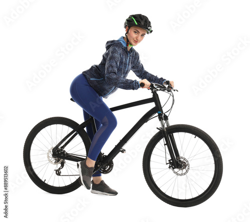 Beautiful young woman in helmet riding bicycle on white background