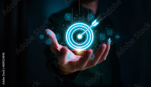 Businessman with target arrow virtual digital technology icon, business investment objectives and goals Marketing strategies and goals for success.