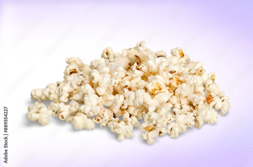 Flying tasty fresh salt popcorn on background Flying tasty fresh salt popcorn on background
