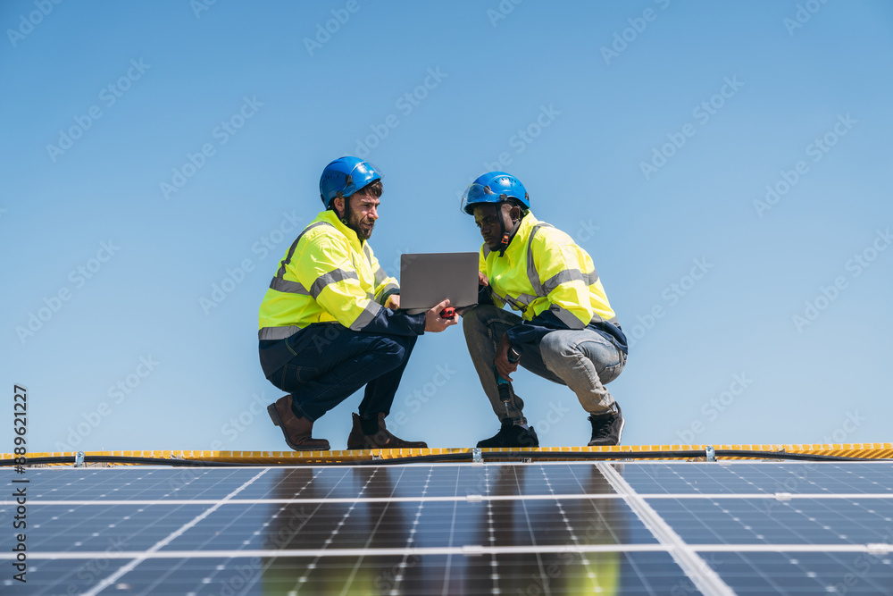 The engineer installs the solar panel, promoting the clean energy concept. The engineer installs the solar panel, promoting the clean energy concept.