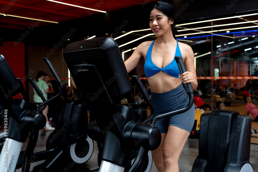 young woman exercising using tools in a sitting position young woman exercising using tools in a sitting position