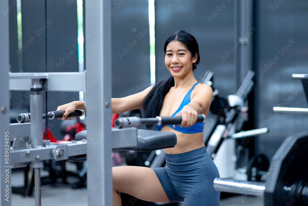young woman exercising using tools in a sitting position