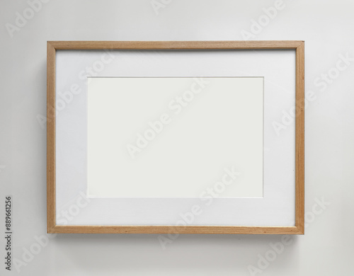 Wooden photo frame A4 size with White Photo Mat, horizontal artwork on a white wall, front view