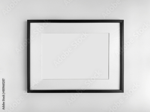 Принти на полотні Black photo frame A4 size with White Photo Mat, horizontal artwork on a white wa