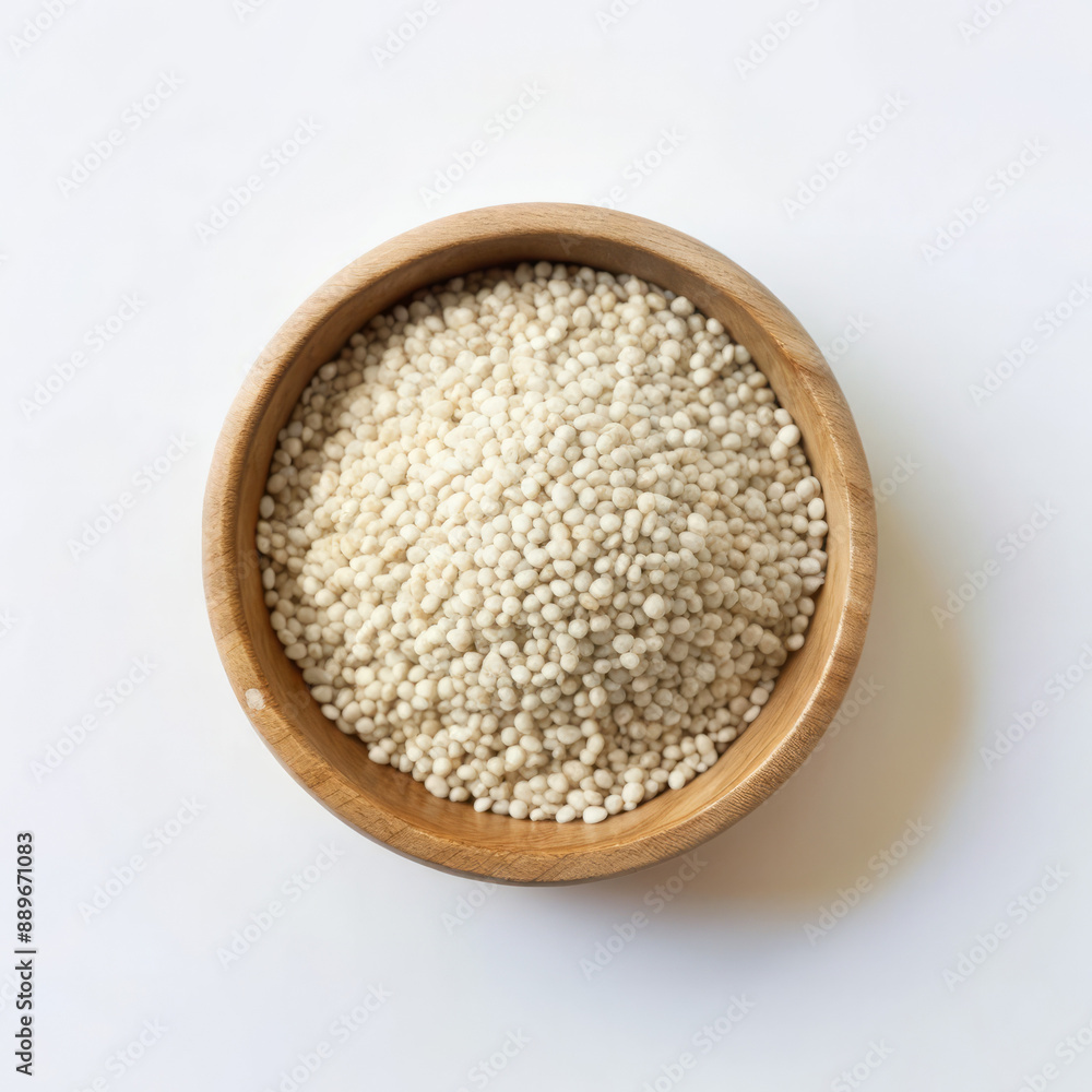 A top view Bio natural sesame seeds on wooden bowl closeup on white background A top view Bio natural sesame seeds on wooden bowl closeup on white background