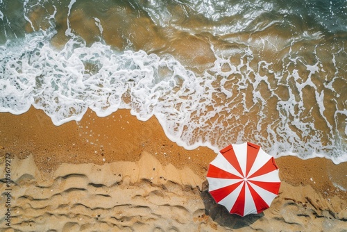 Red and White Umbrella on Sandy Beach