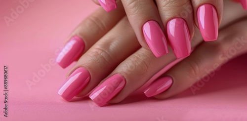 Close Up of a Hand With Pink Gel Nail Polish