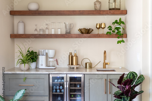 Stylish kitchen wet bar with floating shelves above
