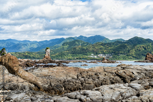 Dramatic rock formations on the coast of Pacific Ocean in Nachikatsuura, Wakayama, Japan, part of the Yoshino-Kumano National Park and Nanki Kumano geopark. photo