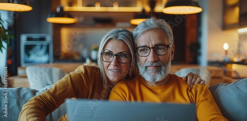 Senior Couple Using Laptop at Home in the Evening